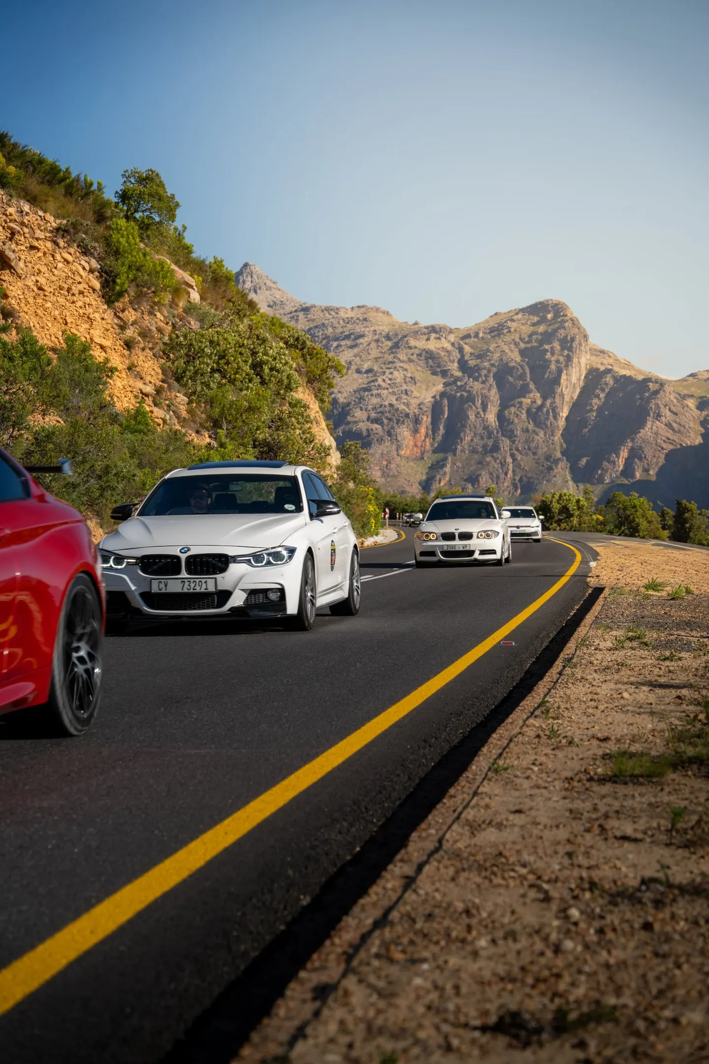A line of cars following the leader up the mountain pass on Run 4